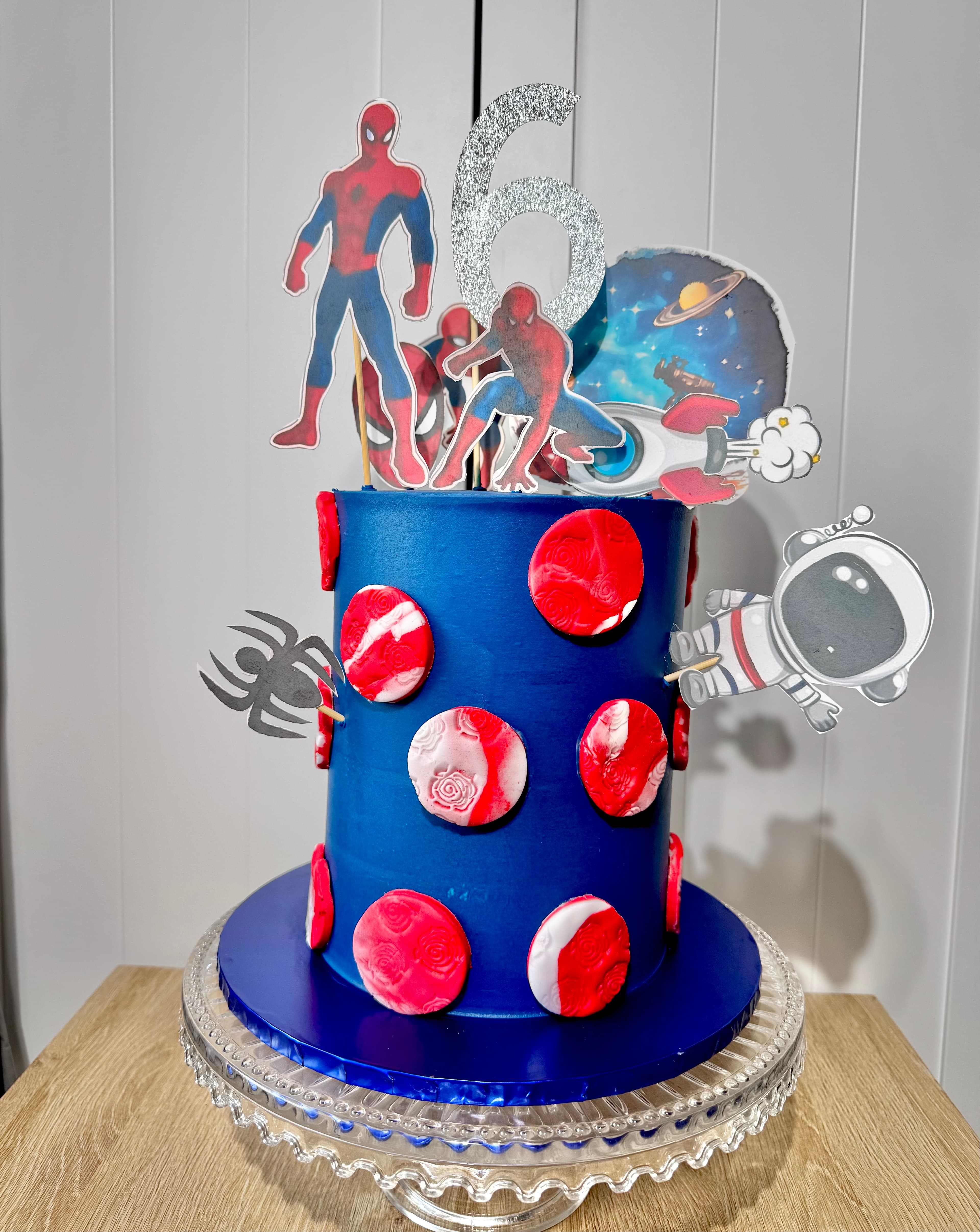 Blue superhero and space themed birthday cake